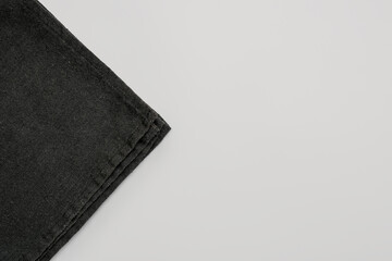Black napkin on grey background