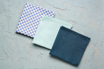Set of clean folded napkins on color background - obrazy, fototapety, plakaty