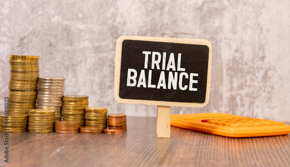 Poster trial balance text written on a notebook with pencils.