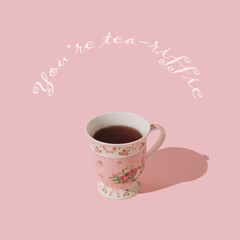 Fancy composition made of pink cup of tea on pastel pink background with 