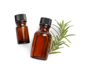 Sprig of fresh rosemary and essential oil on white background, top view