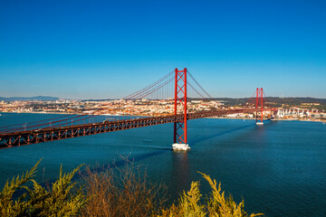 The 25th April Bridge (Ponte 25 de Abril) in Lisbon, Portugal. View from Almada