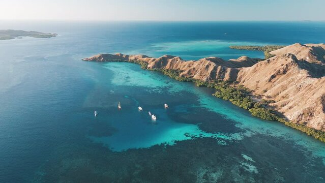 Aerial view of the Komodo National Park. Live aboard boats anchored in the clam bay of the Komodo National Park in Indonesia