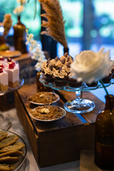 dessert table at a wedding with gold leaf raspberries