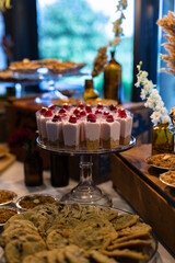 dessert table at a wedding with gold leaf raspberries