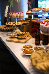dessert table at a wedding with gold leaf raspberries