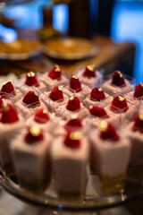 Obraz na płótnie Canvas dessert table at a wedding with gold leaf raspberries