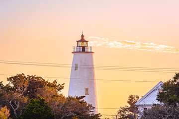 Ocracoke Lighthouse on Ocracoke Island , North Carolina at sunset.The lighthouse was built to help...