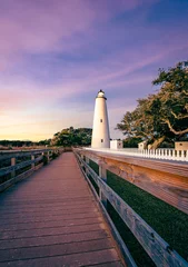 Rolgordijnen Ocracoke Lighthouse on Ocracoke Island , North Carolina at sunset.The lighthouse was built to help guide ships through Ocracoke Inlet into Pamlico Sound. © Chansak Joe A.
