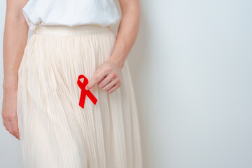 woman with Red Ribbon for December World Aids Day, acquired immune deficiency syndrome, Sexual...