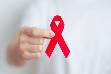 woman with Red Ribbon for December World Aids Day, acquired immune deficiency syndrome, multiple...