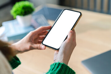 Human working on modern smartphone with blank white mobile screen for advertising, mockup, technology, advertising, search information, creative design, social media, online marketing, chat, phone