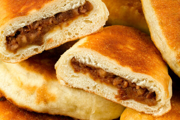 Fried pies with stuffing close-up. Homemade cakes. © Сергей Васильченко