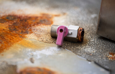 Rusty metal background with a lock and a piece of old paint