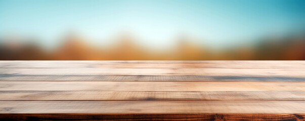 Empty wooden table over blurred nature and blue sky background, product display montage. High quality photo