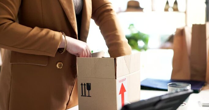 Woman, tablet and packing box in logistics, shipping or online order for delivery or payment at store. Closeup of female person, hands and technology with package, parcel or cargo for courier service
