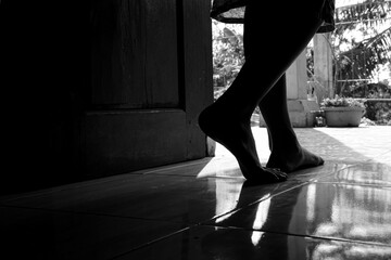 silhouette of a person standing on the floor