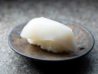 Fototapeta na wymiar Raw squid sushi on plate