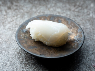 Raw squid sushi on plate