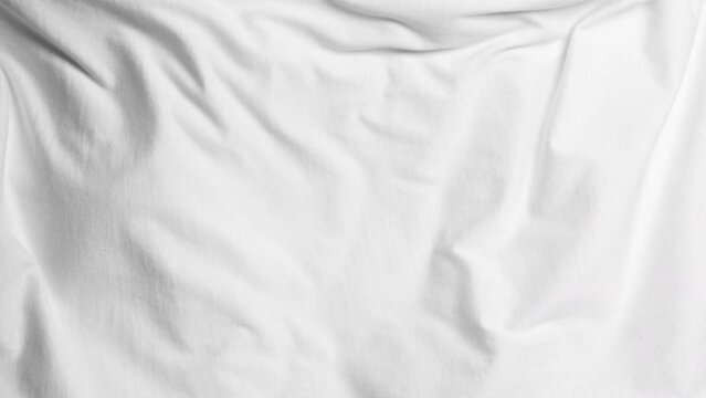 White fabric blowing in slow motion