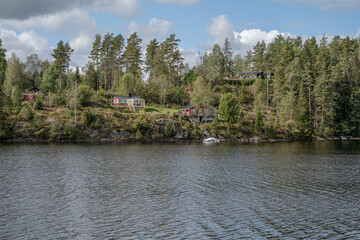 Lake Ragnerudssjoen in Dalsland Sweden beautiful nature forest pinetree swedish houses