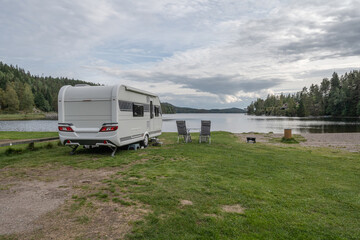 campsite camping caravan by lake Ragnerudssjoen in Dalsland Sweden beautiful nature forest pinetree