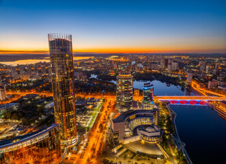 Yekaterinburg city and pond aerial panoramic view at summer or early autumn night. Night city in the early autumn or summer.
