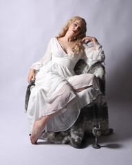 Full length portrait  of blonde woman  wearing  white historical bridal gown fantasy costume dress....