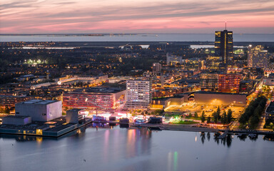 Obraz premium Almere city center illuminated at dusk. Aerial view.