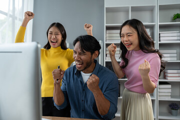 Happy young asian businessman Express joy together and celebrate the success of starting a business. Creative team brainstorming meeting, business partners or teamwork concept of office colleagues.