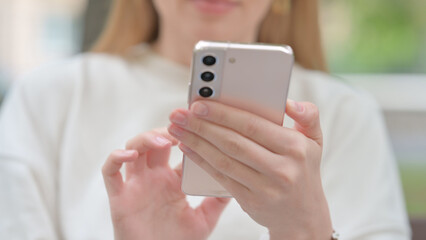Close Up of Woman Using Smartphone Outdoor