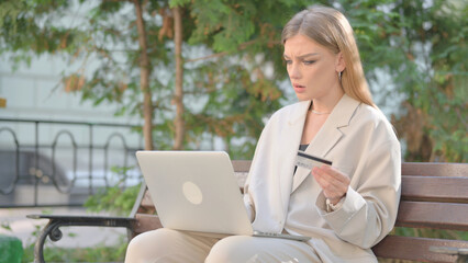 Young Business Lady Upset by Online Payment Failure on Laptop Outdoor