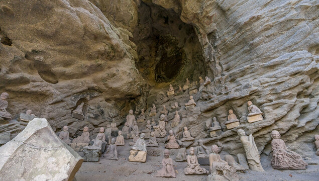 Mount Nokogiri (Nokogiriyama) Cave with some of the 1500 Arhat or Rakan hand carved stone statues. Made between the years 1779-1798 located inside the Nihon-ji Temple complex, Chiba Prefecture, Japan