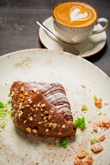 fresh croissant with cup of cappuccino