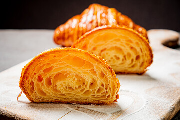 fresh croissant on the wooden board