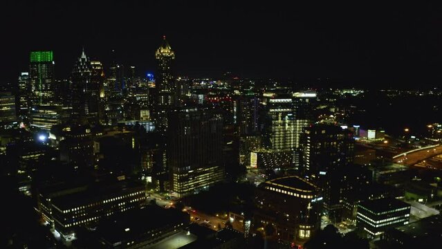 Night shot flying slowly toward the buildings in downtown Atlanta, Georgia.