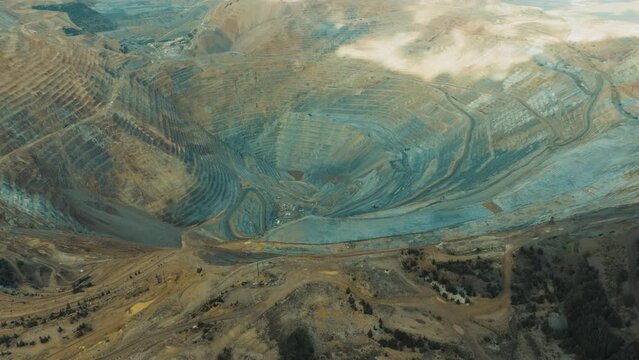 Bingham Copper Mine in Utah - aerial pull back to reveal the Salt Lake valley