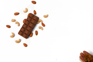 Chocolate with almonds on white background