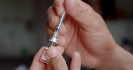 Using syringe suck out of bottle by turning the medicine bottle upside down and slowly pulling the medicine out of the bottle.Small needles are used for injecting animals.