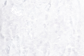 Cosmetic gel, serum transparent sample. Liquid cream with bubble texture. Gel texture of a cosmetic product. Clear liquid lotion for skin care.