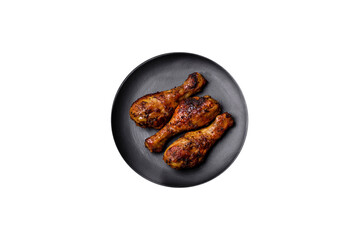 Delicious ruddy grilled chicken legs with spices and herbs