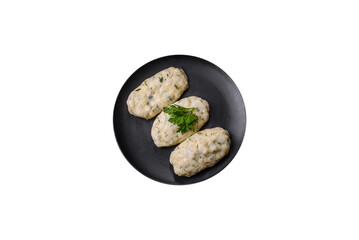 Traditional Lithuanian dish zeppelin, boiled potato dumplings stuffed with minced meat © chernikovatv