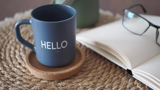 blue coffee cup with hello word