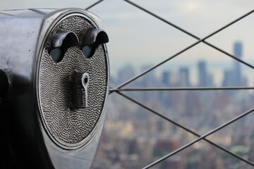 coin operated binocular, A telescope looking with Manhattan in the background