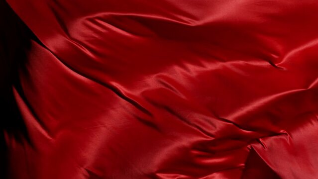 Red fabric blowing in slow motion