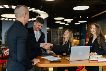 Business partners shake hands making successful deal on meeting in commercial firm. Business company new investors partners