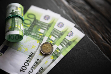 100 euro banknote pack and wood bankground. Currency, financial