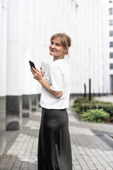 Young businesswoman talking on smartphone, self made woman