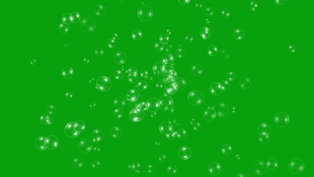 Soap bubbles revolving on green screen background