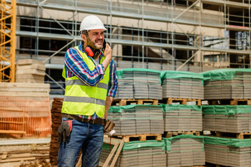 Supervisor talking on the phone on construction site
